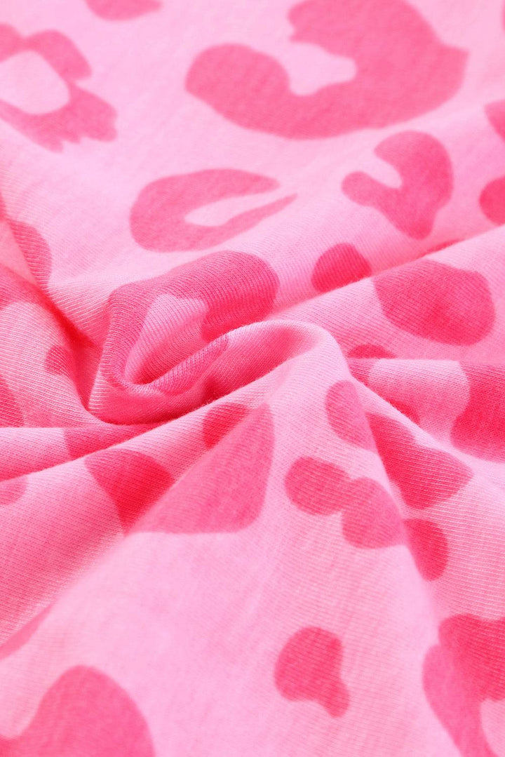 a pink and white fabric with hearts on it