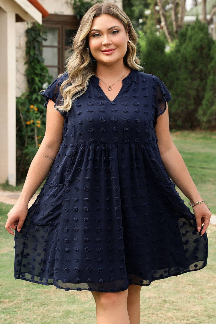Navy Blue Dotty Textured Notched Neck Plus Ruffled Dress with flutter sleeves and side pockets, styled for summer at Faith & Co. Boutique.