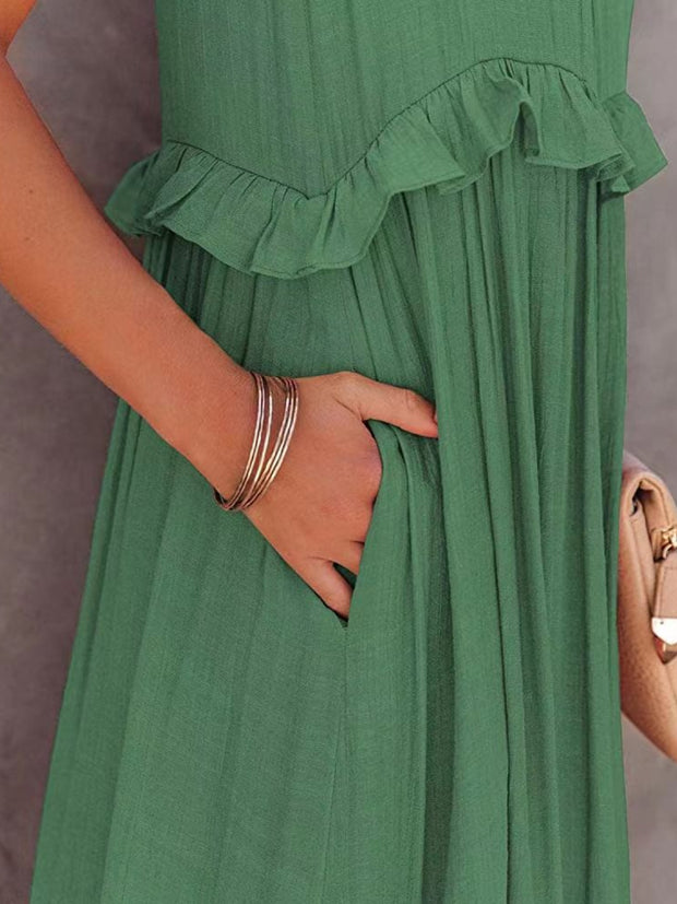 a woman in a green dress holding a purse