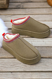 a pair of slippers on a wooden deck