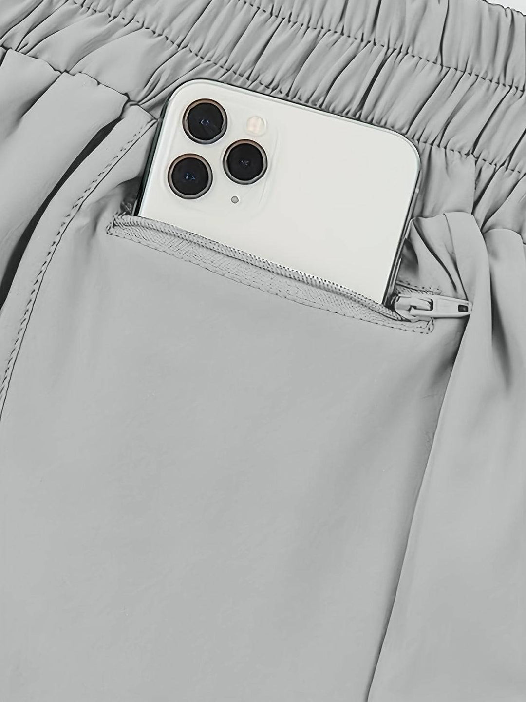 a cell phone in the pocket of a pair of pants