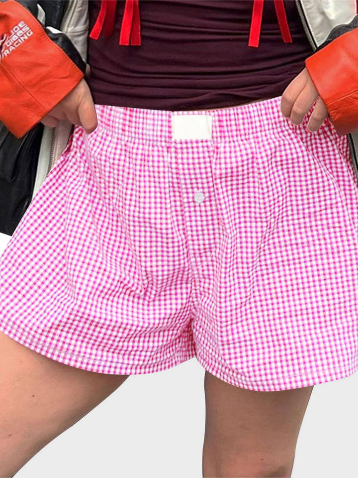 a person wearing a red and white checkered boxer shorts