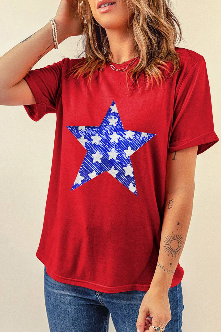 a woman wearing a red shirt with a blue and white star on it