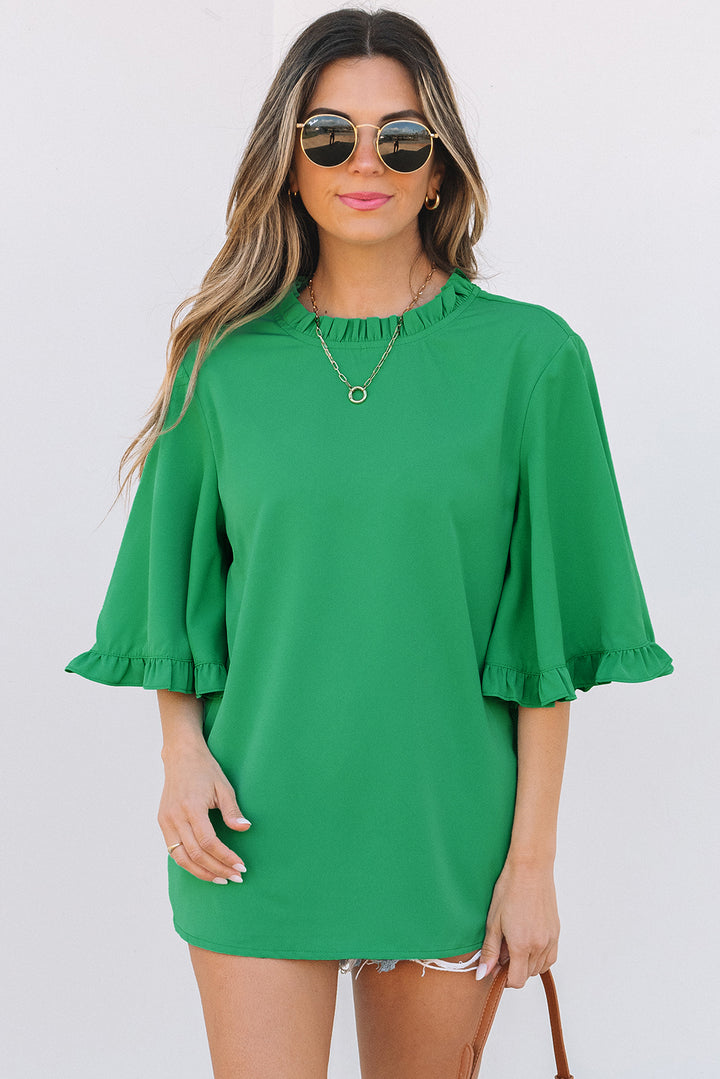 Front view of Green Frilly Round Neck Wide Half Sleeve Blouse styled with accessories, great for daily summer outfits.