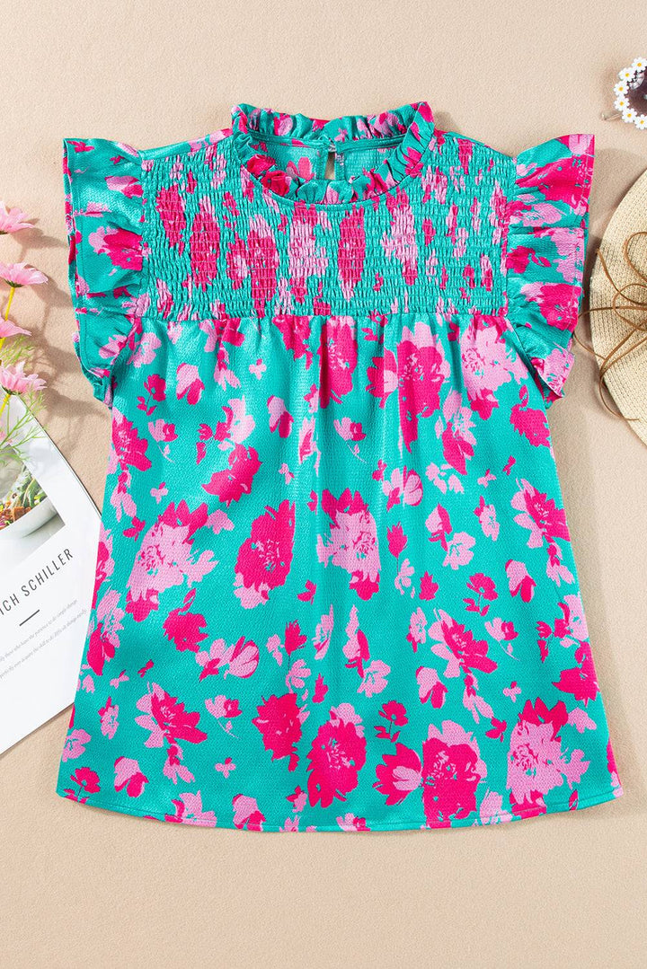 a little girl's blue and pink dress with pink flowers