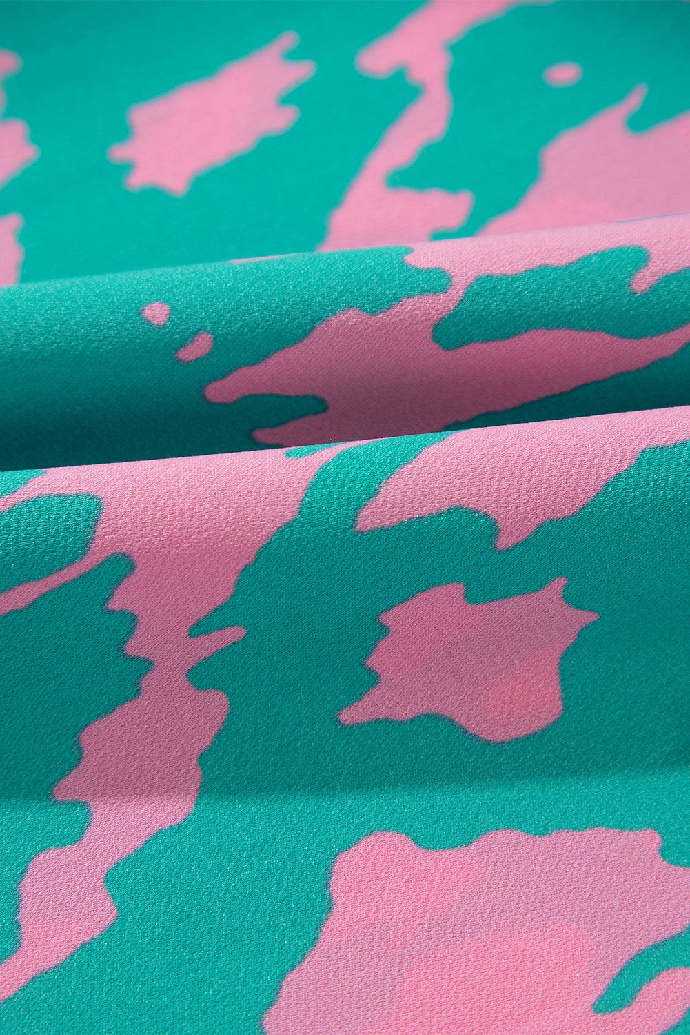 a pink and green camouflage print fabric