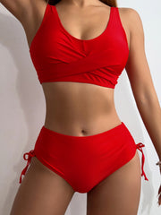a woman in a red bikini top and matching panties