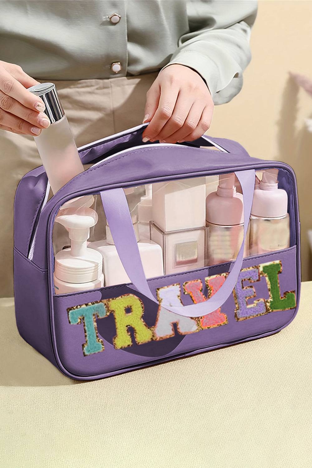 a person holding a purple travel bag filled with personal care products