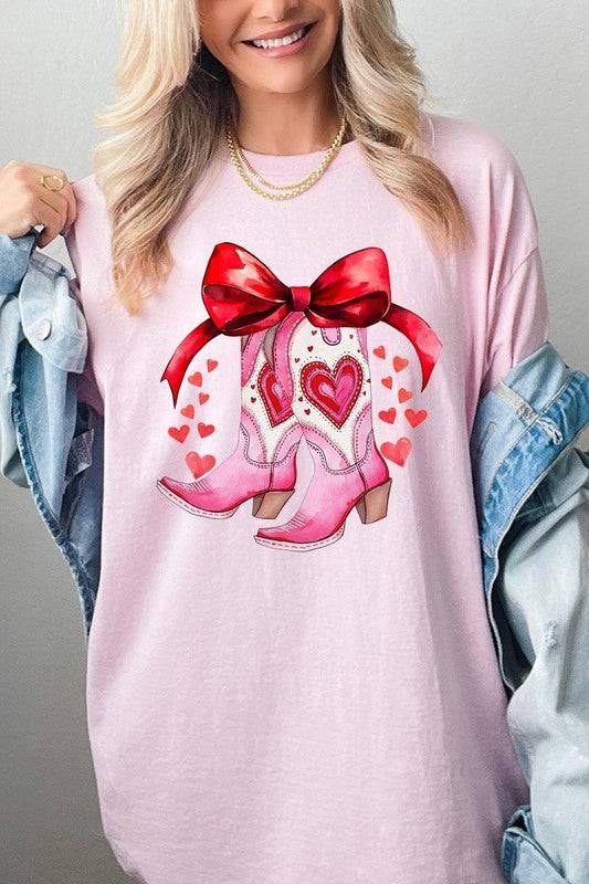 Light pink Valentine Cowgirl Boots Graphic Heavy Cotton Tee featuring pink boots with red hearts and bow, shop at Faith & Co. Boutique.