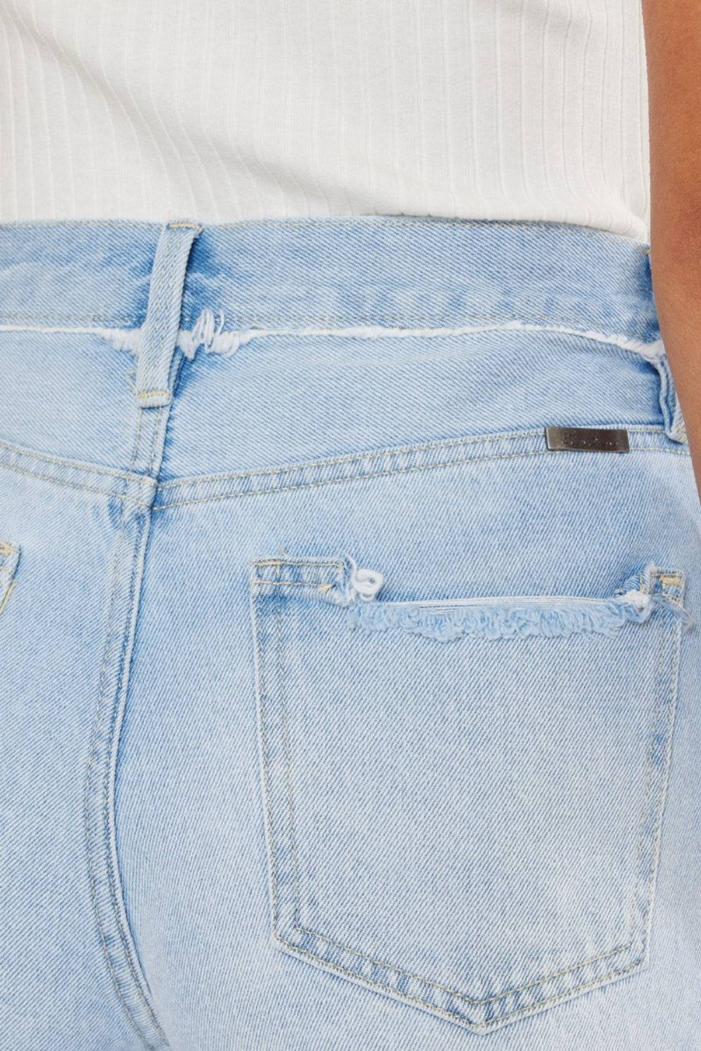 a close up of a person wearing a pair of jeans
