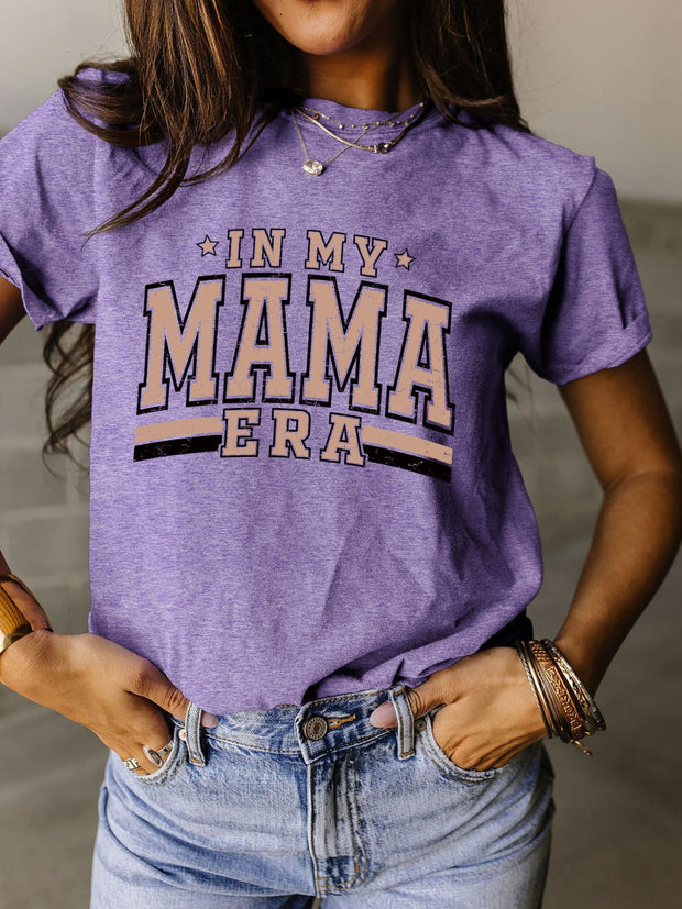 a woman wearing a purple shirt that says in my mama era