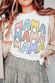 a woman wearing a t - shirt with the words mama on it