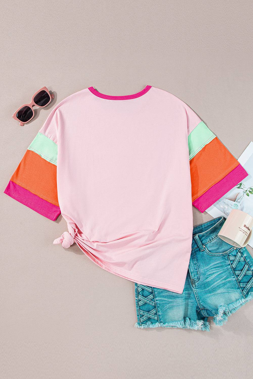 a pink shirt, shorts, sunglasses and a pair of sunglasses