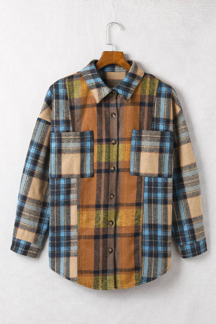 a plaid shirt hanging on a clothes hanger