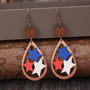 a pair of earrings with red, white and blue stars