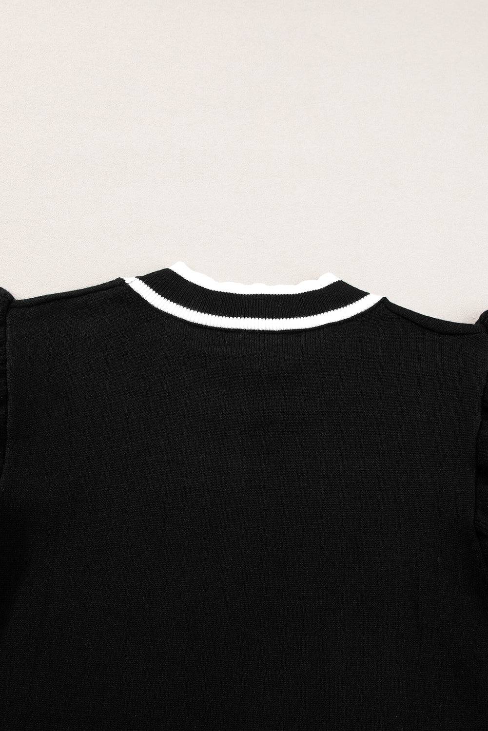 a black t - shirt with a white collar