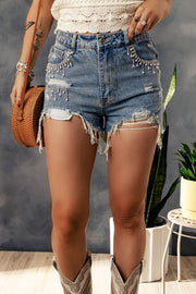 a woman wearing a pair of shorts and cowboy boots