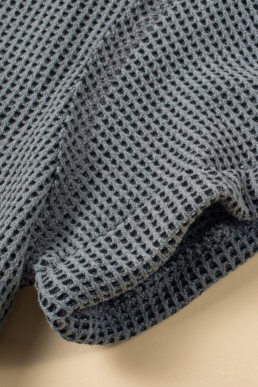 a close up of a sweater on a table