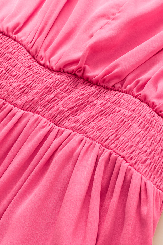 a close up of a pink dress on a mannequin