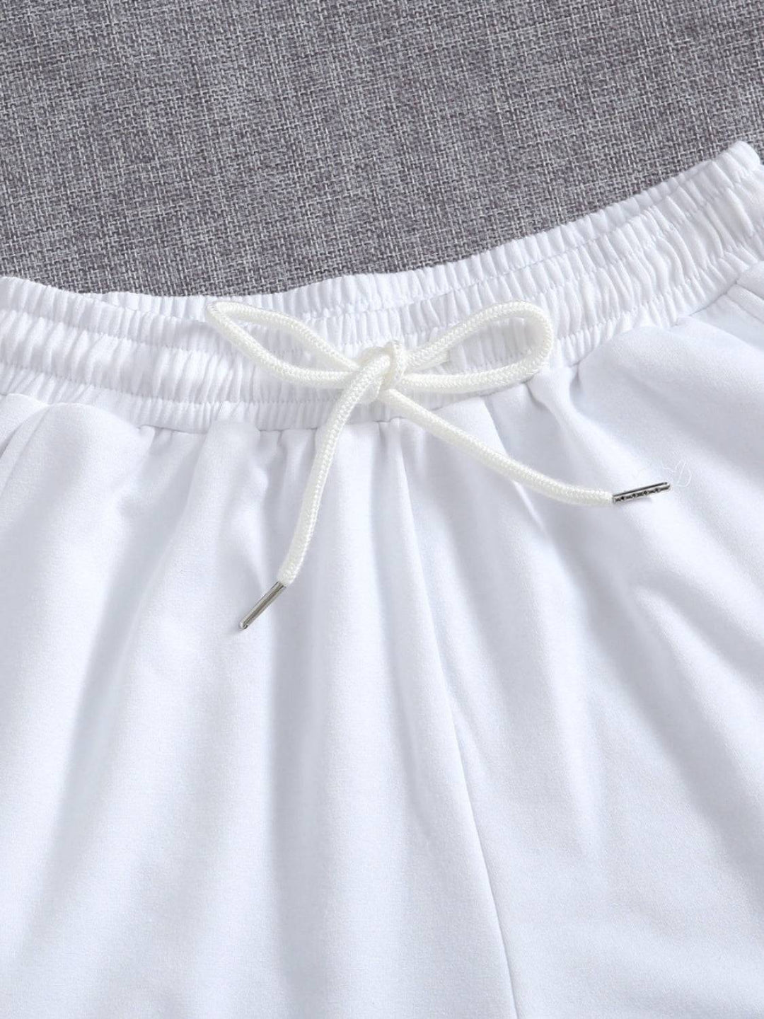 a close up of a pair of white shorts
