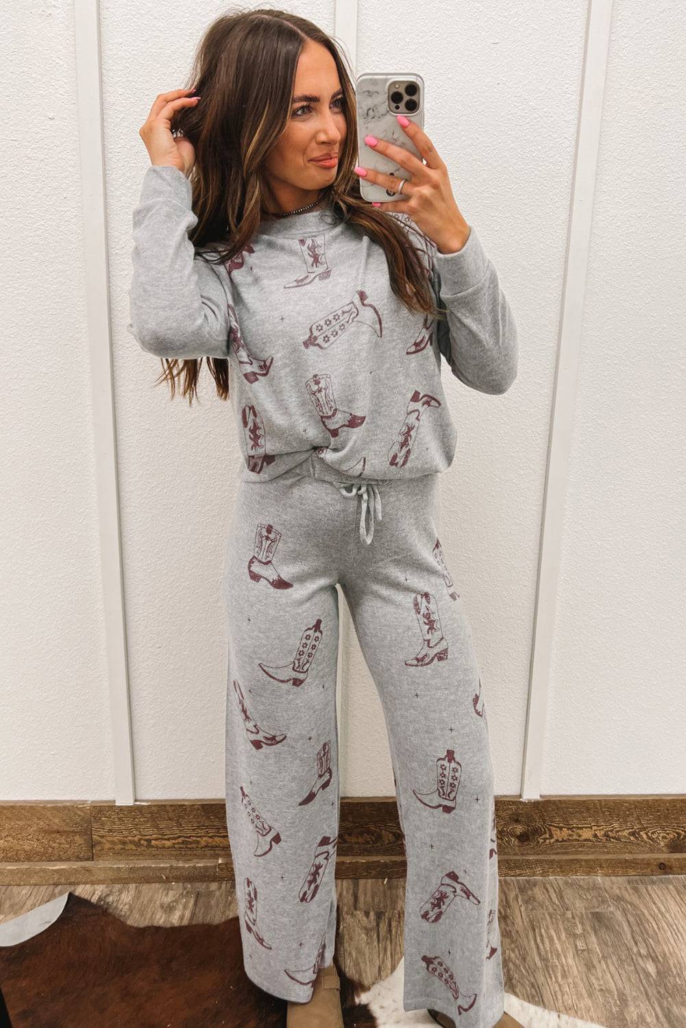 a woman taking a selfie in pajamas