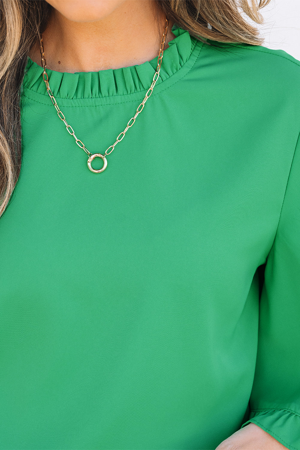 Detailed neckline view of Green Frilly Round Neck Wide Half Sleeve Blouse with gold necklace, perfect for accessorizing.