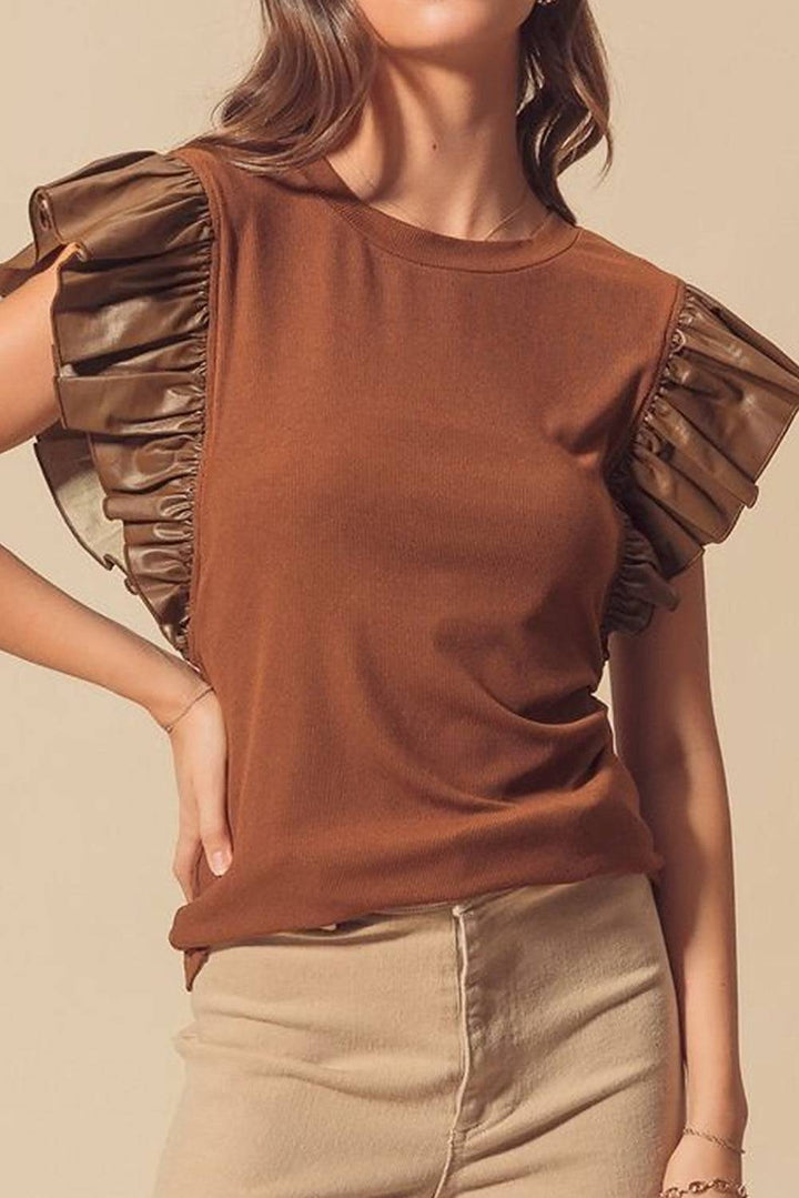 Brown Leather Ruffle Sleeve Patchwork Round Neck Blouse styled with beige pants, a chic Southern Belle top from Faith & Co. Boutique.