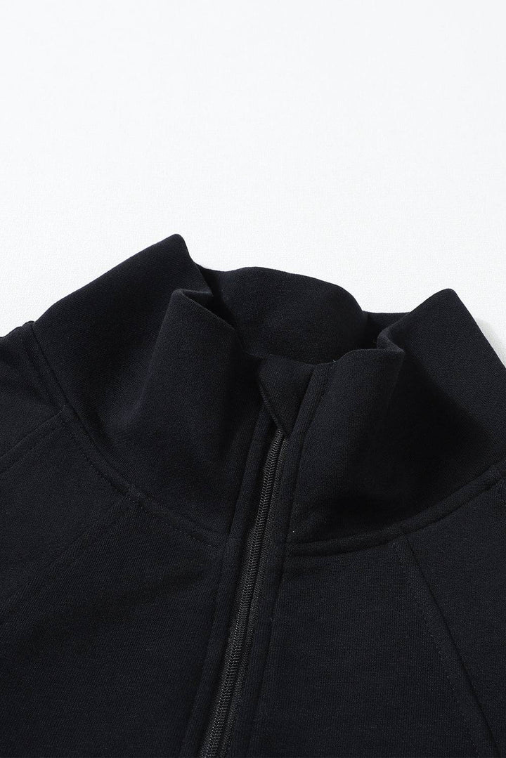 a close up of a black jacket with a zipper