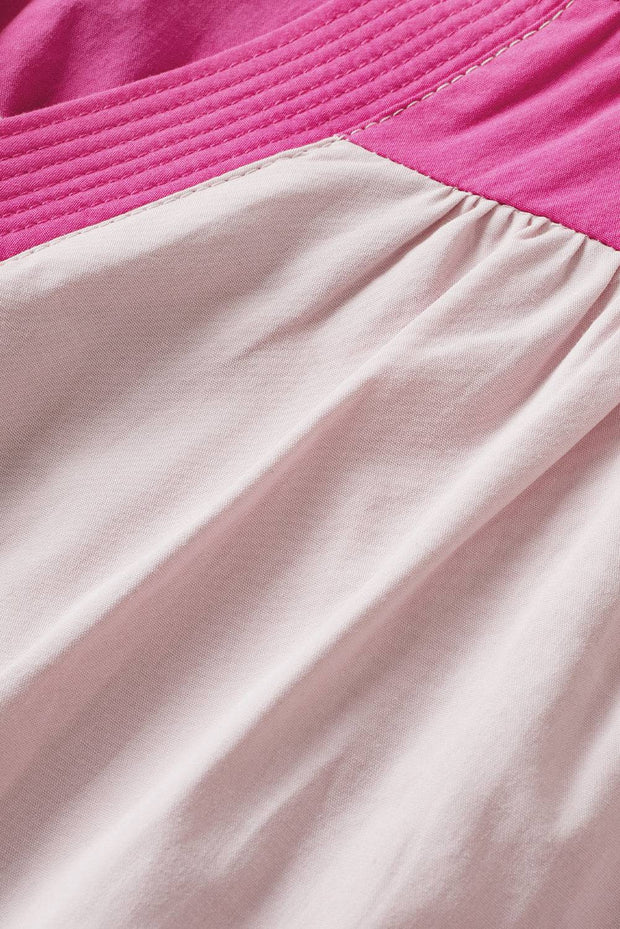 a close up of a pink and white dress