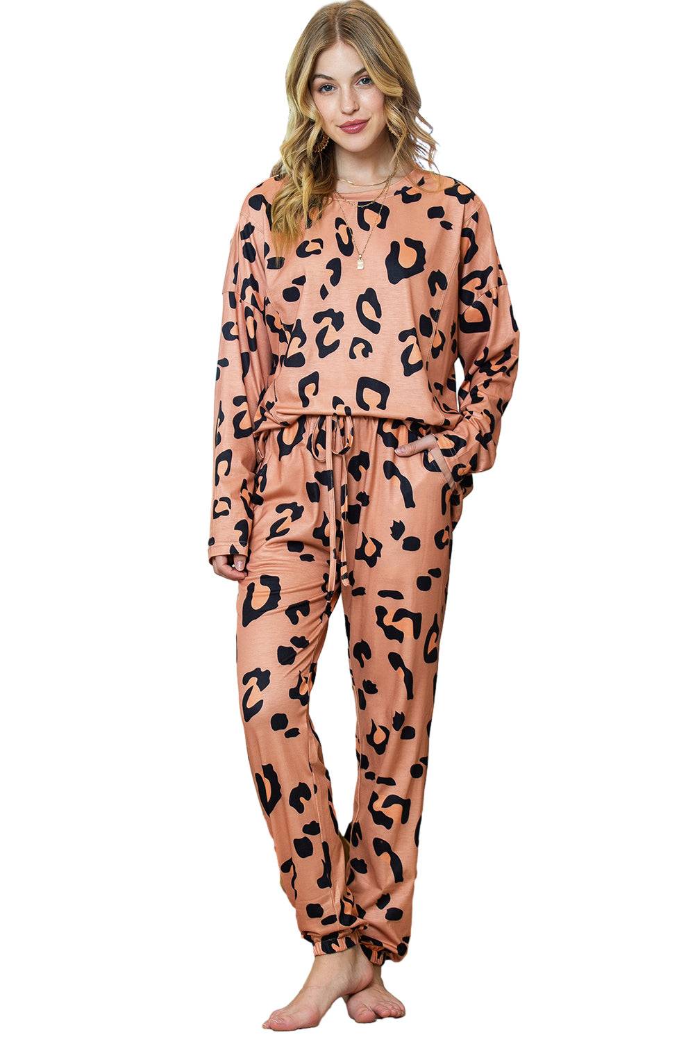a woman wearing a pink and black animal print pajamas