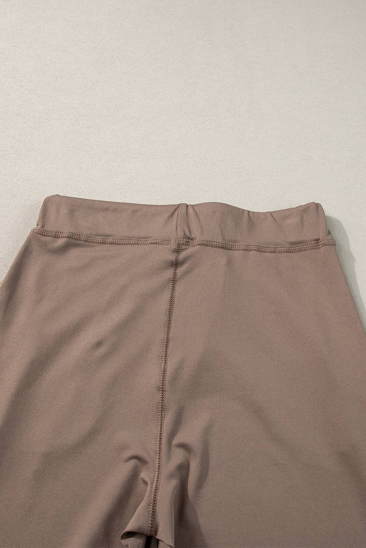 a close up of a person's pants on a white surface