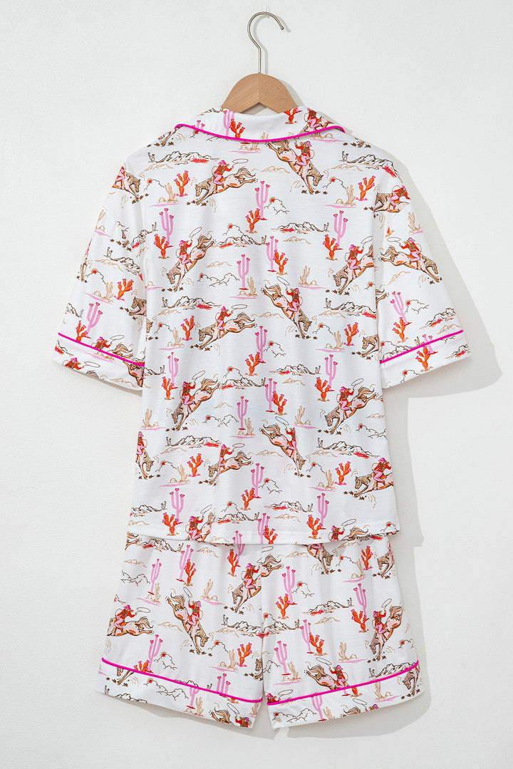 Close-up of pajama shorts from White Cowgirl Country Print Pajamas Set with cowgirl and cactus design. Shop White Cowgirl Country Print Pajamas Set at Faith & Co. Boutique.