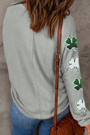a woman wearing a st patrick's shamrock sweater