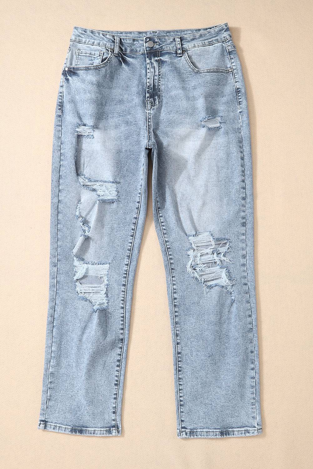 a pair of light blue jeans with holes on them