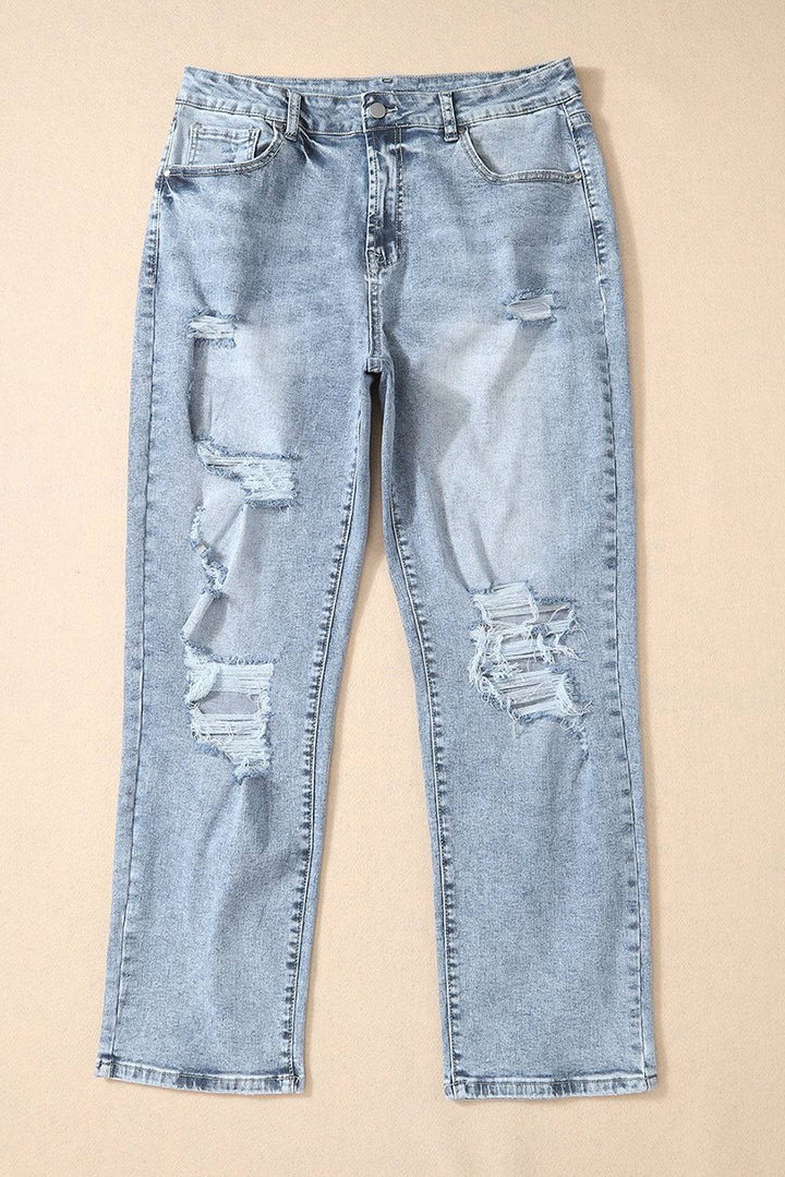 a pair of light blue jeans with holes on them