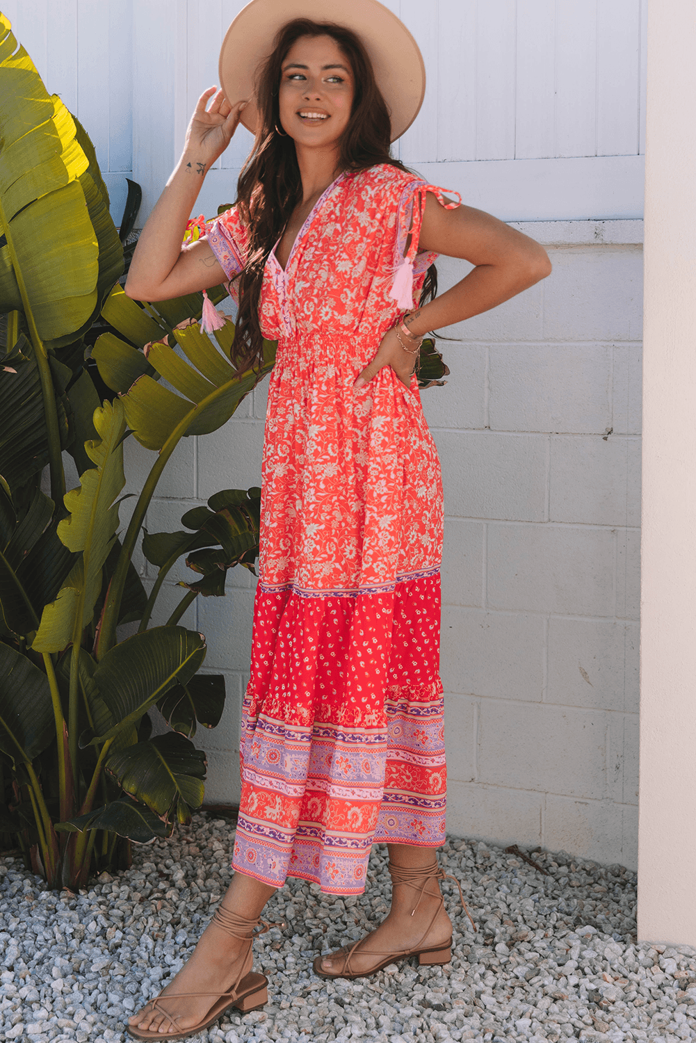side view of model in Red Floral Print Tasseled Tied Sleeve Empire Waist Maxi Dress, perfect for summer and boho-inspired outfits