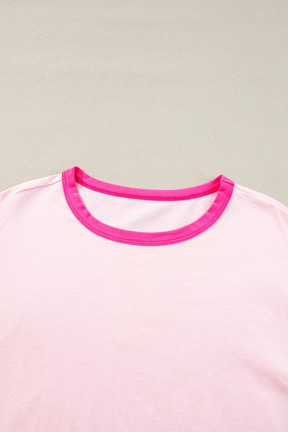 a pink t - shirt with a pink stripe on it