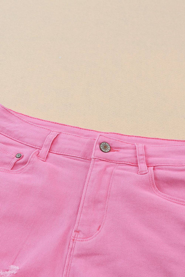 a pair of pink jeans with a hole in the side