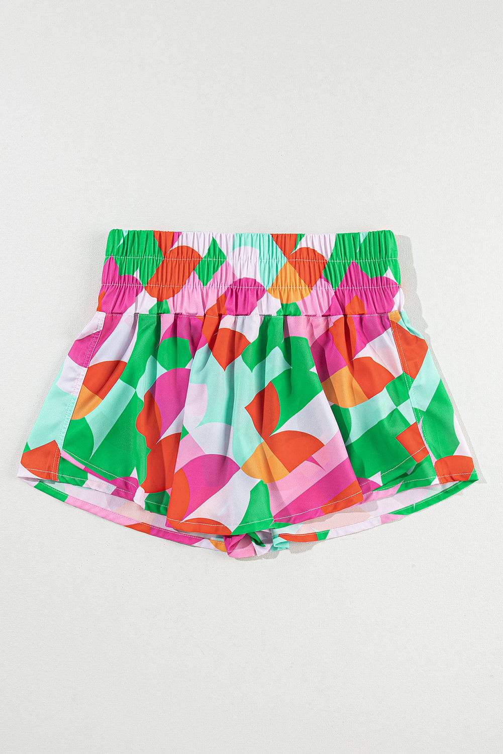 a pair of colorful shorts hanging on a wall