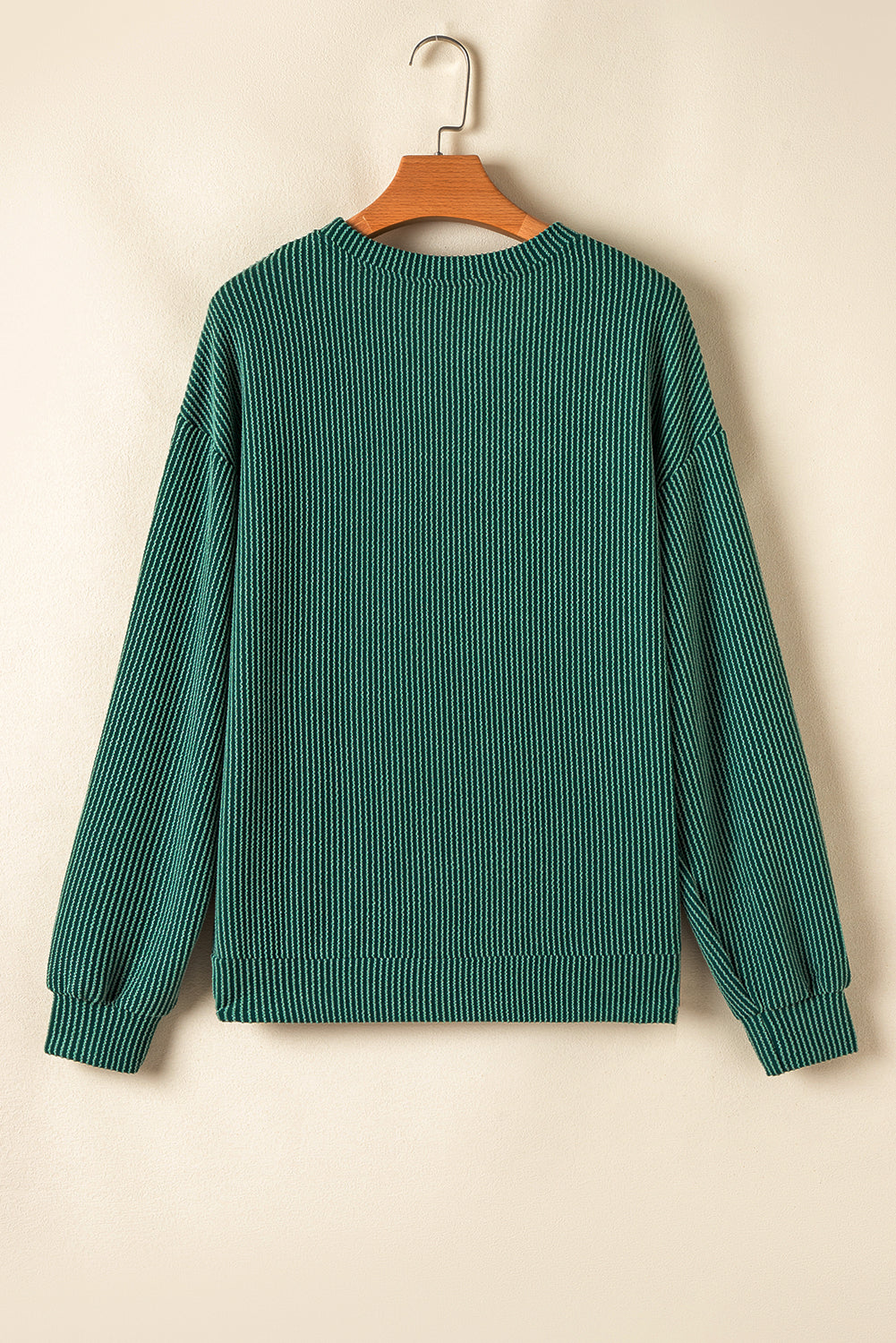Back view of green Evergreen JOLLY Corded Top showing ribbed texture. Casual holiday apparel from Faith & Co. Boutique.