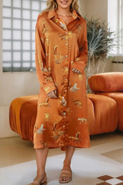 a woman standing in a room wearing an orange robe