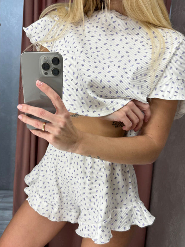 a woman in a white dress holding a cell phone
