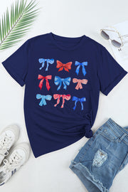 a t - shirt with bows on it next to a pair of shorts