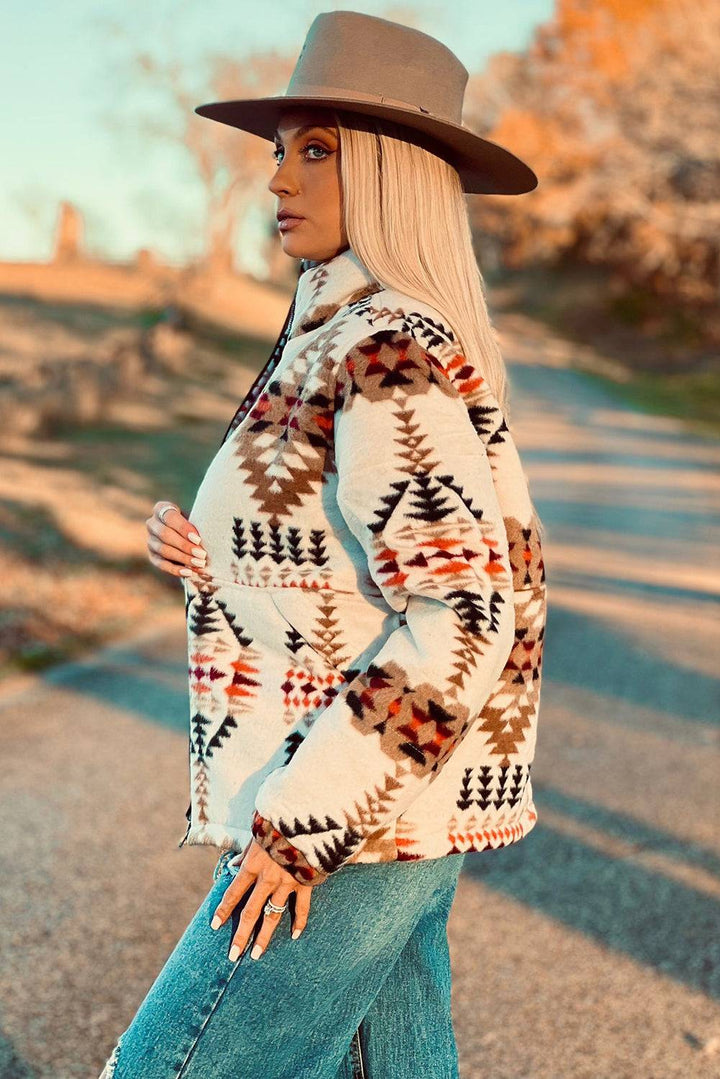 a woman in a hat is standing on a road