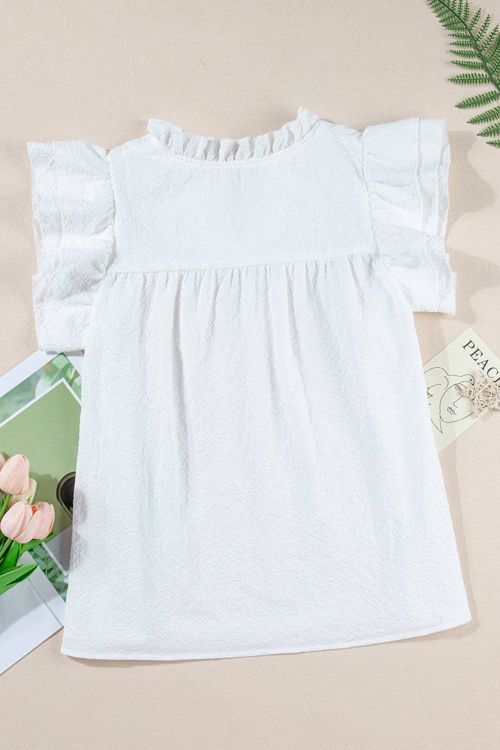 a picture of a baby girl's white dress