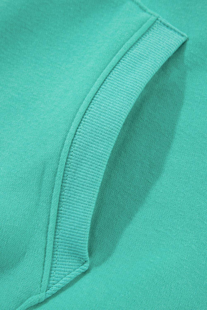 a close up of a green t - shirt