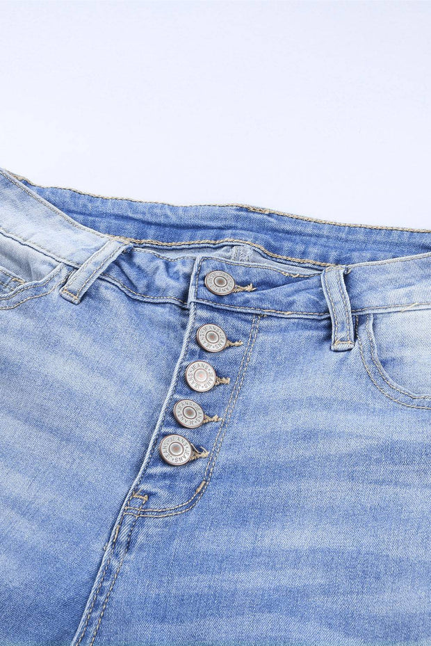 a pair of jeans with buttons on them