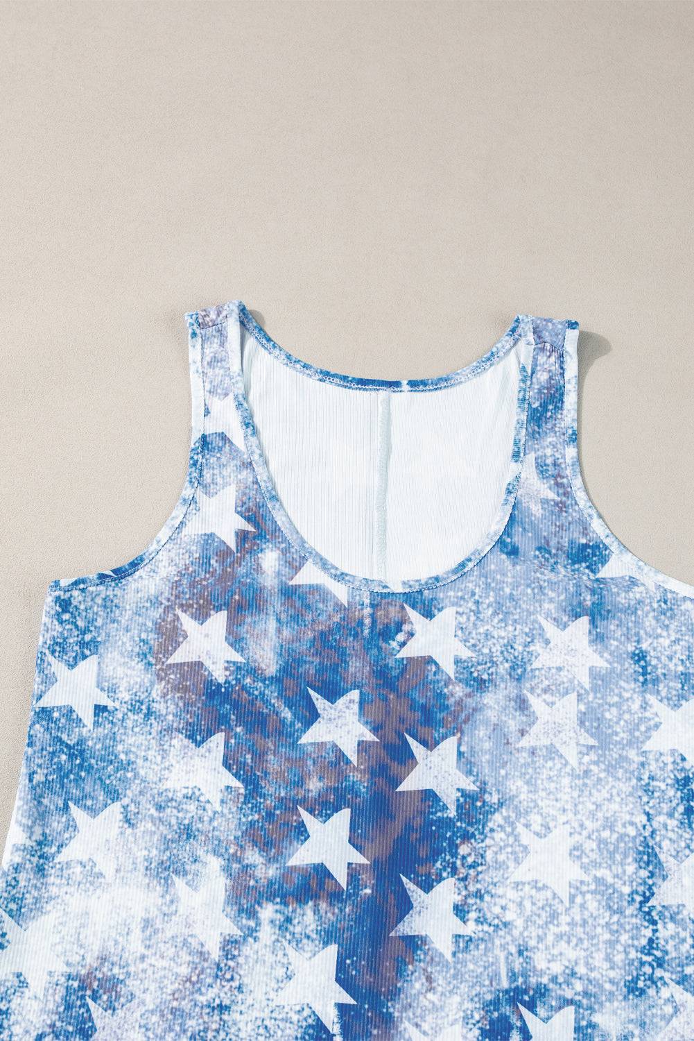 a blue and white tank top with stars on it