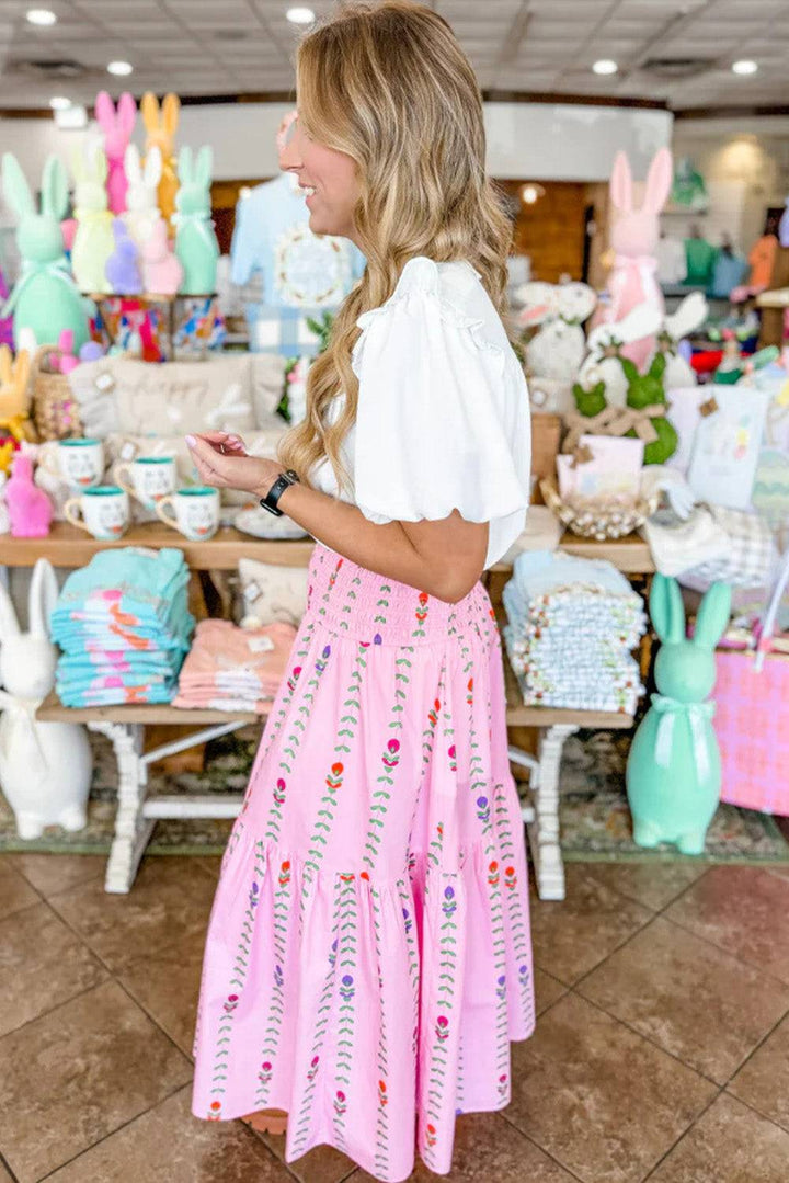 a woman standing in front of a table filled with easter decorations