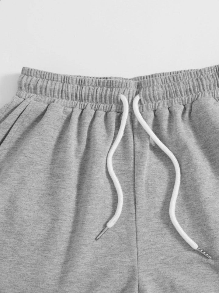 a close up of a pair of grey sweat shorts